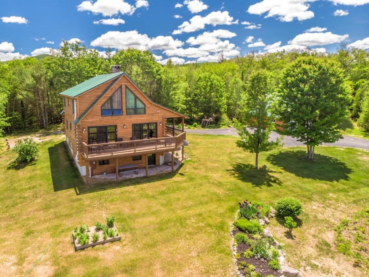 an overhead view of a log cabin in the woods at The Hive at Blue Spruce Lodge White Mnts View in Brownfield