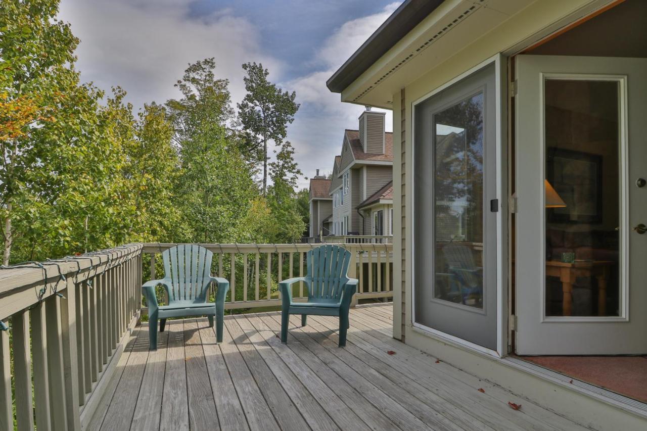 two chairs sitting on a deck with a door at Locke Mountain D1 in Newry