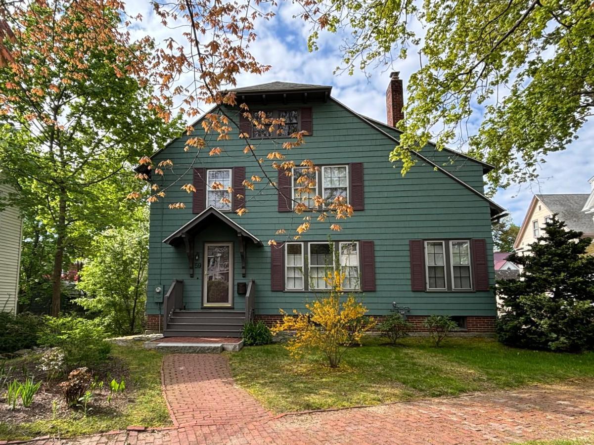 a green house with a gambrel at The Highland House in Portland