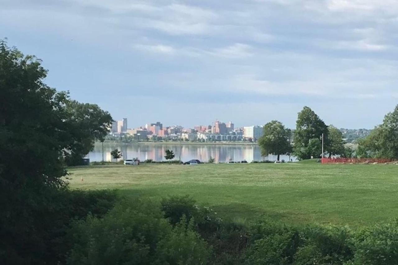 a park with a lake and a city in the background at Top Deck Portland Property with Views in Portland