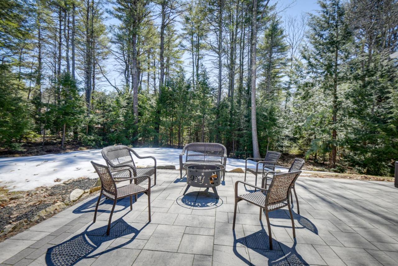 a group of chairs sitting around a grill on a patio at Stunning Wells Home with Fire Pit and Porch! in Wells